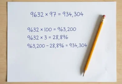 Handwritten solution of 9632x97 equals 934,304 on white paper with a pencil beside it
