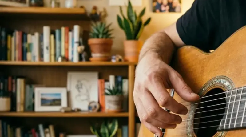 Pulsamento: Everything You Need to Know (Without the Confusion) 1 Close-up of a guitarist's fingers plucking a single nylon string on a classical guitar in warm natural light, showing the pulsamento fingerstyle technique.